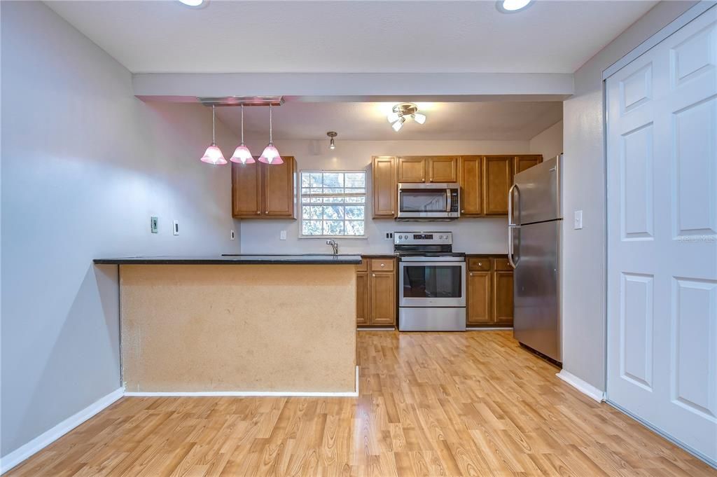 Interior, Kitchen, Pendant Lights, Recessed Lighting, Stainless Steel Appliances, Wood Texture Flooring