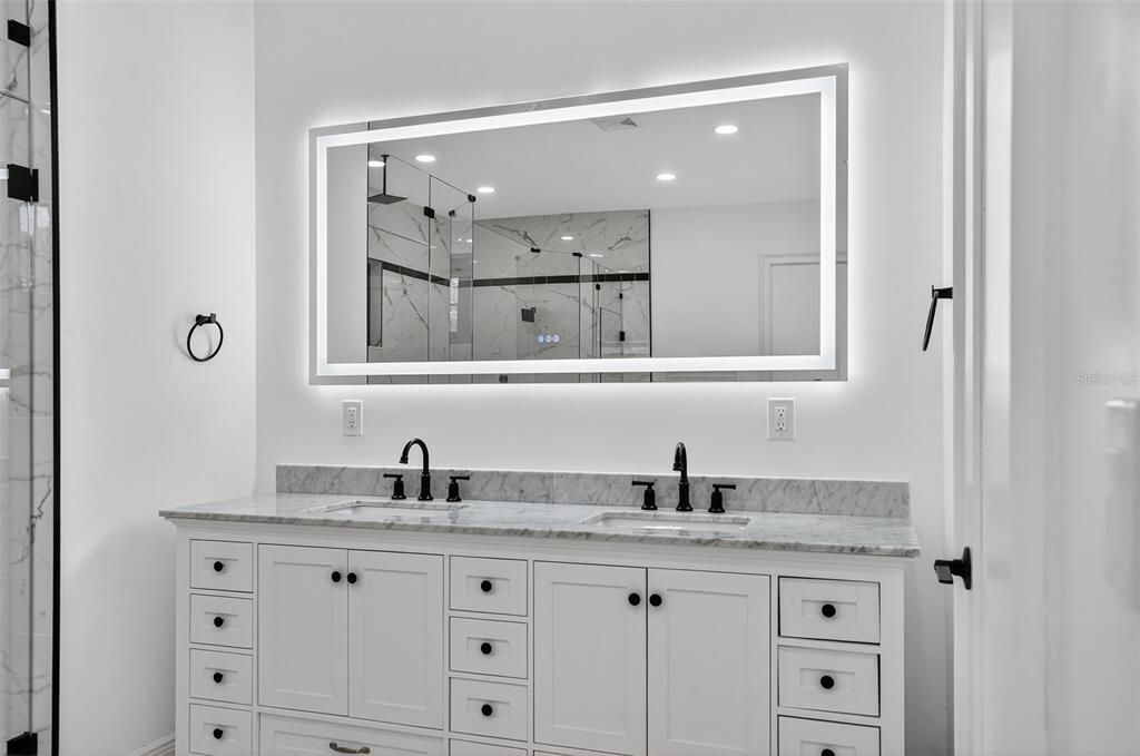 Bathroom, Dual Sink Vanities, Glass Shower, Interior, Marble Walls, Recessed Lighting