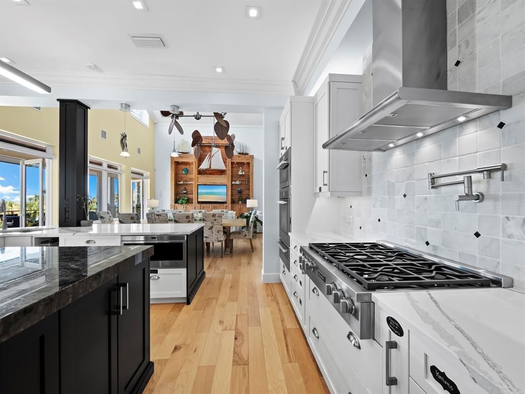 Dining room, Interior, Kitchen, Recessed Lighting, Stainless Steel Appliances, Wood Texture Flooring