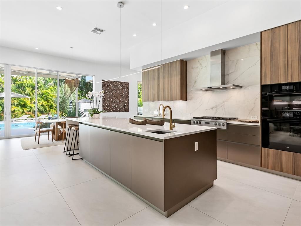 Interior, Kitchen, Marble Walls, Pendant Lights, Recessed Lighting, Stainless Steel Appliances