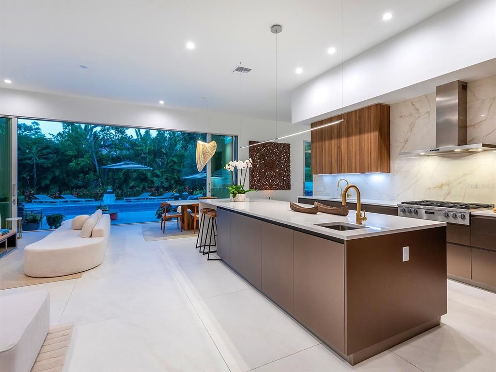 Interior, Kitchen, Marble Walls, Pendant Lights, Recessed Lighting, Stainless Steel Appliances