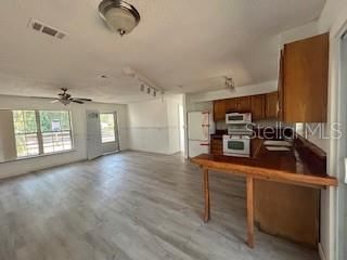 Empty room, Interior, Kitchen, Stainless Steel Appliances, Wood Texture Flooring