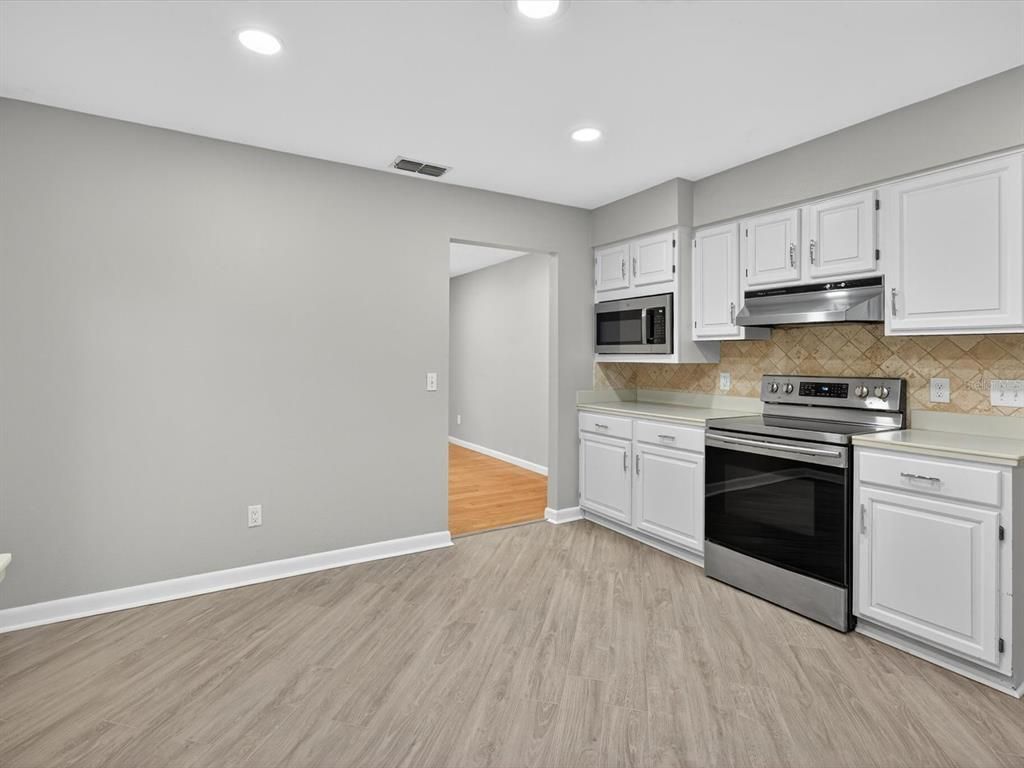 Interior, Kitchen, Recessed Lighting, Stainless Steel Appliances, Wood Texture Flooring