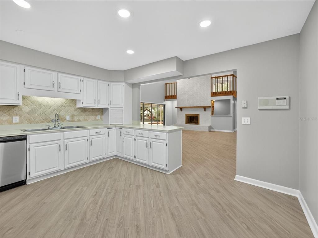 Fireplace, Interior, Kitchen, Recessed Lighting, Wood Texture Flooring