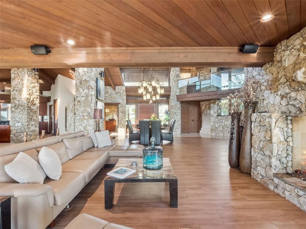 Chandelier, Dining room, Interior, Living room, Recessed Lighting, Stone Walls, Wooden Beams, Wooden Ceilings, Wood Texture Flooring