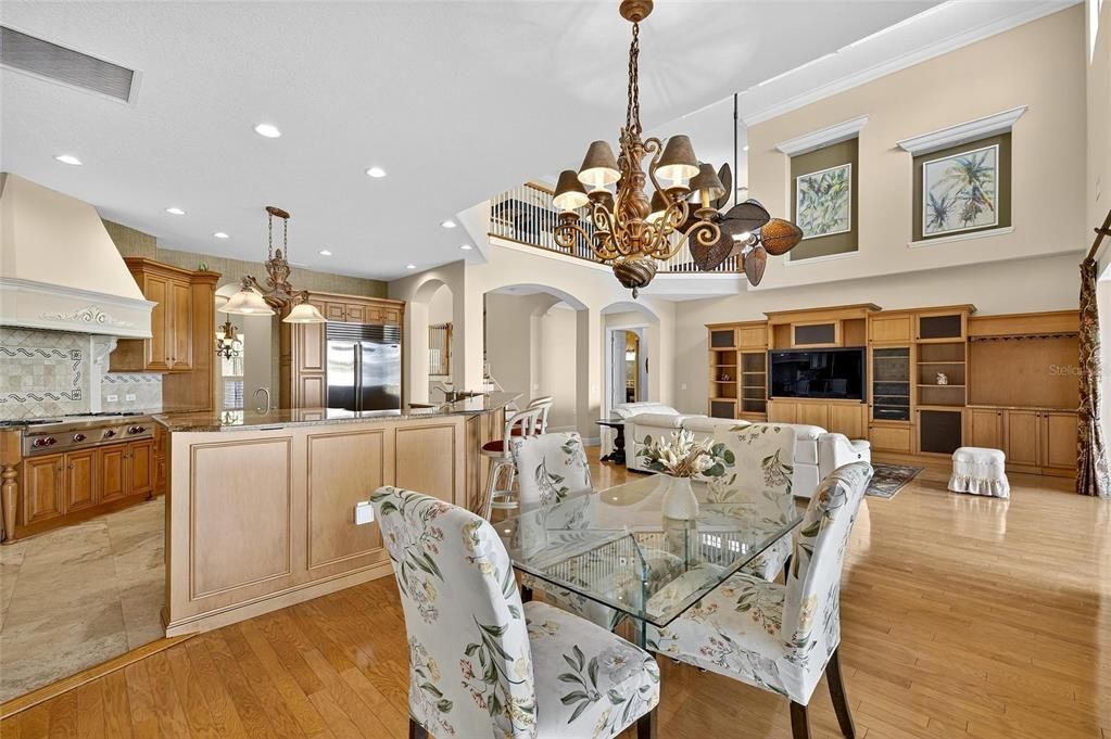 Chandelier, Dining room, Interior, Kitchen, Living room, Recessed Lighting, Stainless Steel Appliances, Wood Texture Flooring