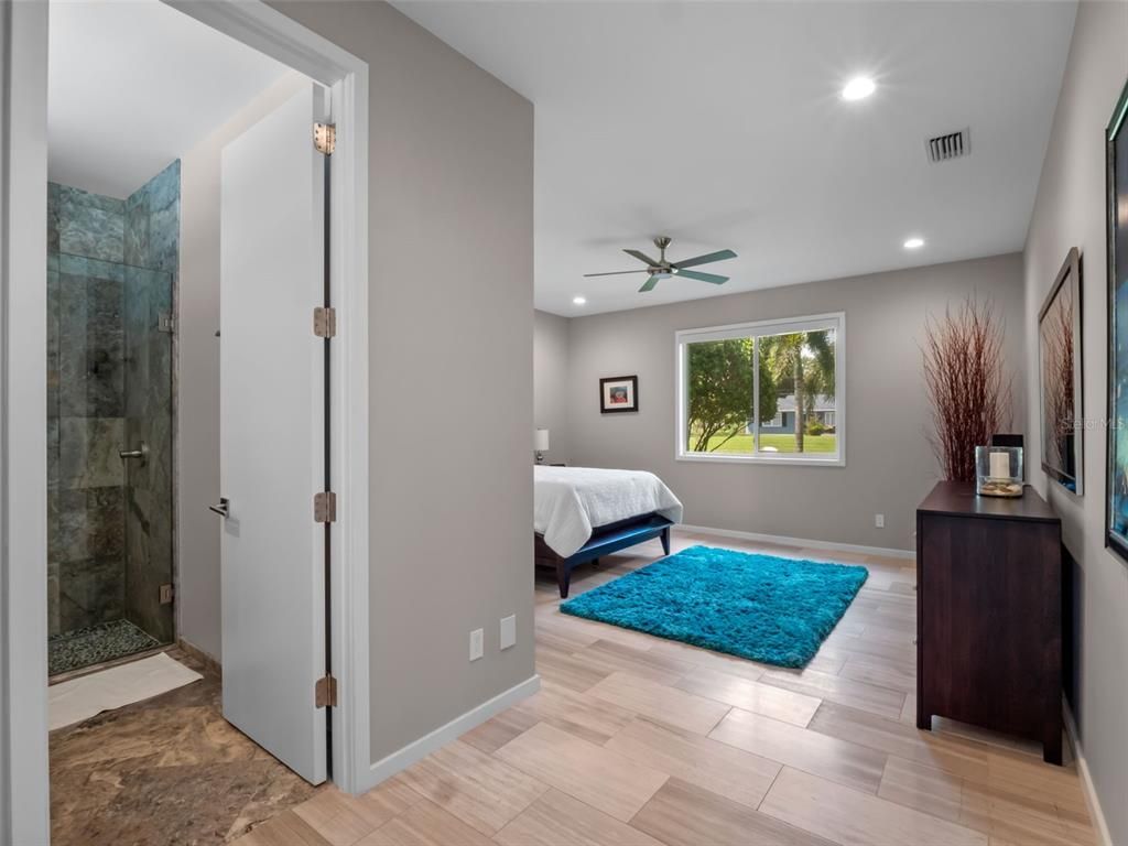 Bathroom, Bedroom, Glass Shower, Interior, Recessed Lighting, Wood Texture Flooring