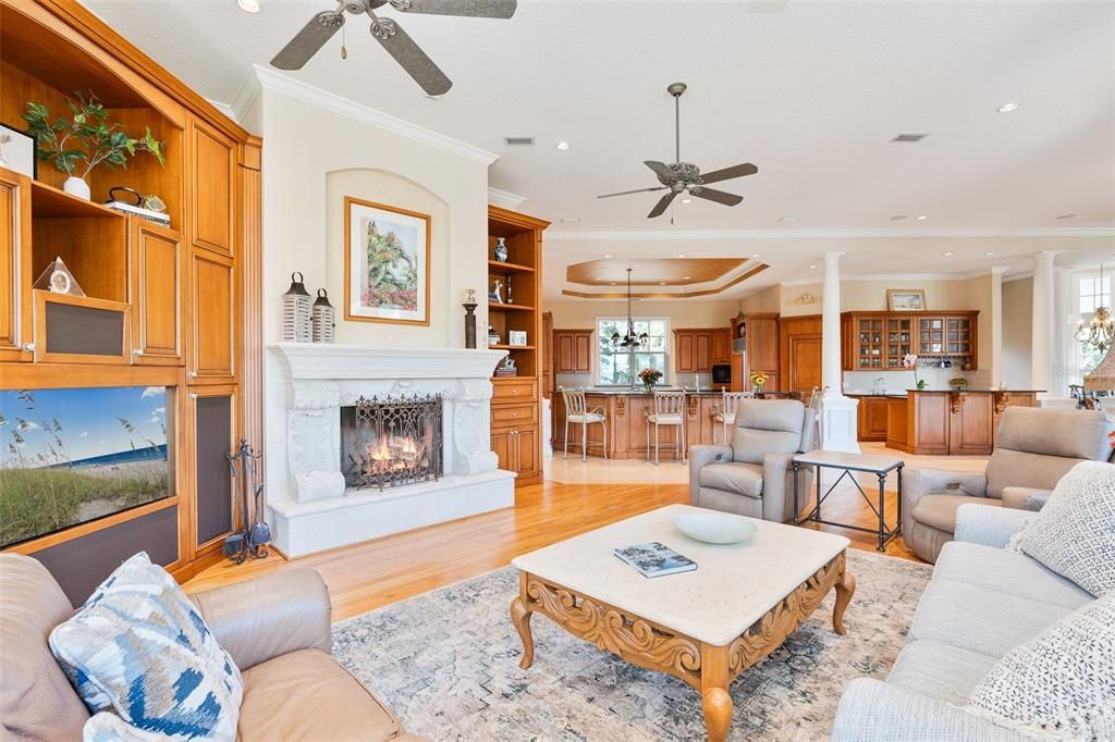 Chandelier, Fireplace, Interior, Kitchen, Living room, Pendant Lights, Recessed Lighting, Wood Texture Flooring