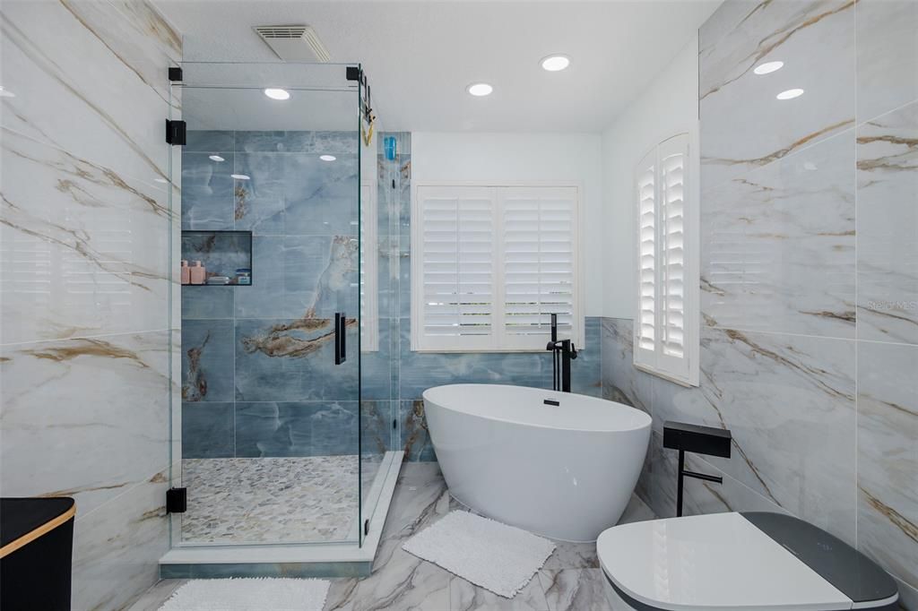 Bathroom, Free Standing Baths, Glass Shower, Interior, Marble, Marble Walls, Recessed Lighting