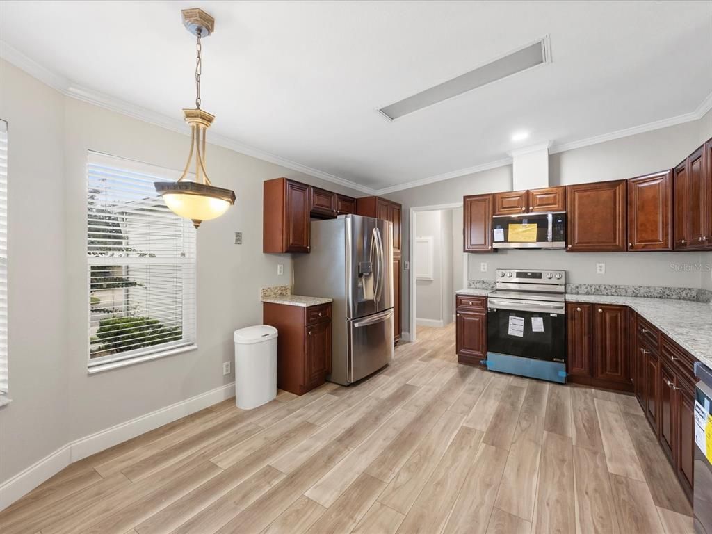 Interior, Kitchen, Pendant Lights, Recessed Lighting, Stainless Steel Appliances, Washer, Wood Texture Flooring