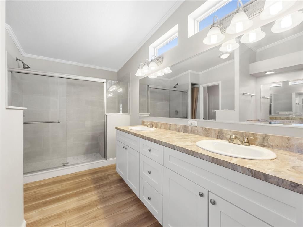 Bathroom, Dual Sink Vanities, Glass Shower, Interior, Tile Countertops, Wood Texture Flooring