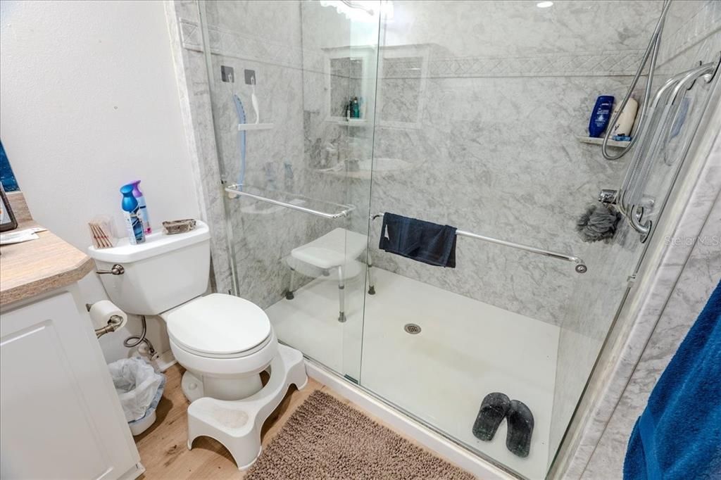 Bathroom, Glass Shower, Interior, Marble Walls, Wood Texture Flooring