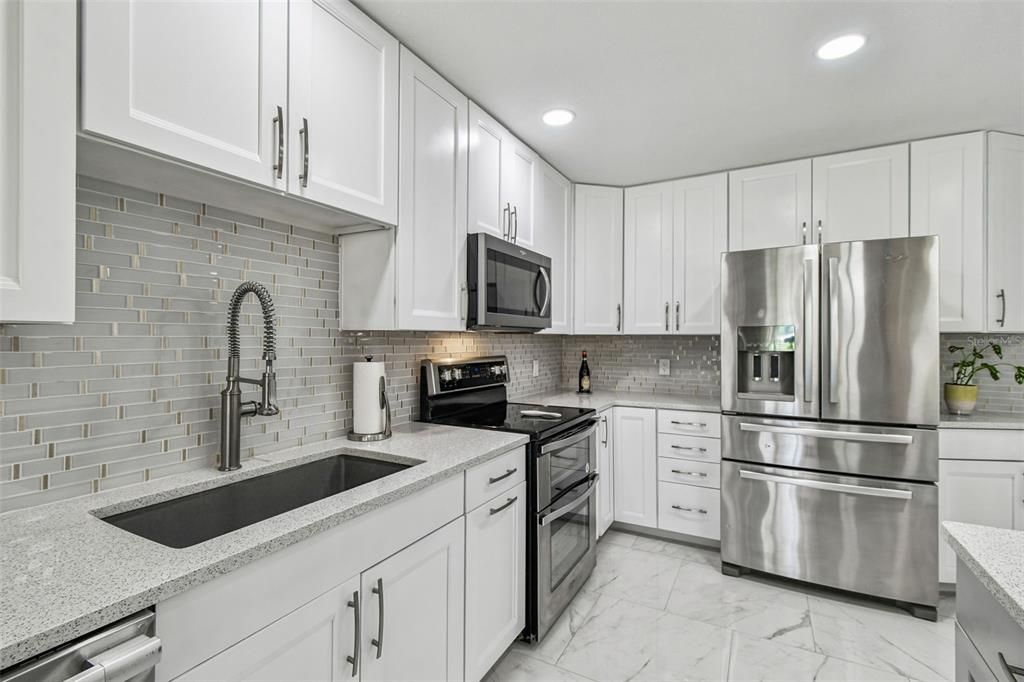 Interior, Kitchen, Marble, Recessed Lighting, Stainless Steel Appliances, Stone Walls