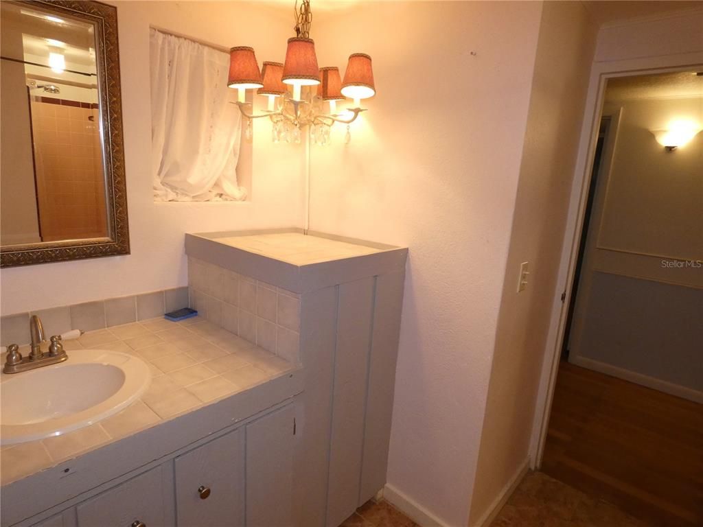 Bathroom, Chandelier, Interior, Tile Countertops, Wood Texture Flooring