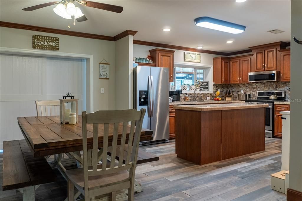Dining room, Interior, Kitchen, Recessed Lighting, Stainless Steel Appliances, Wood Texture Flooring