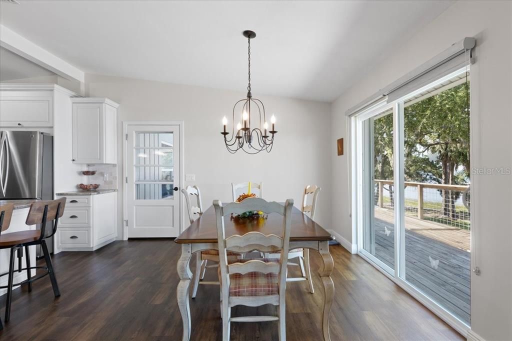 Chandelier, Dining room, Interior, Kitchen, Stainless Steel Appliances, Wood Texture Flooring