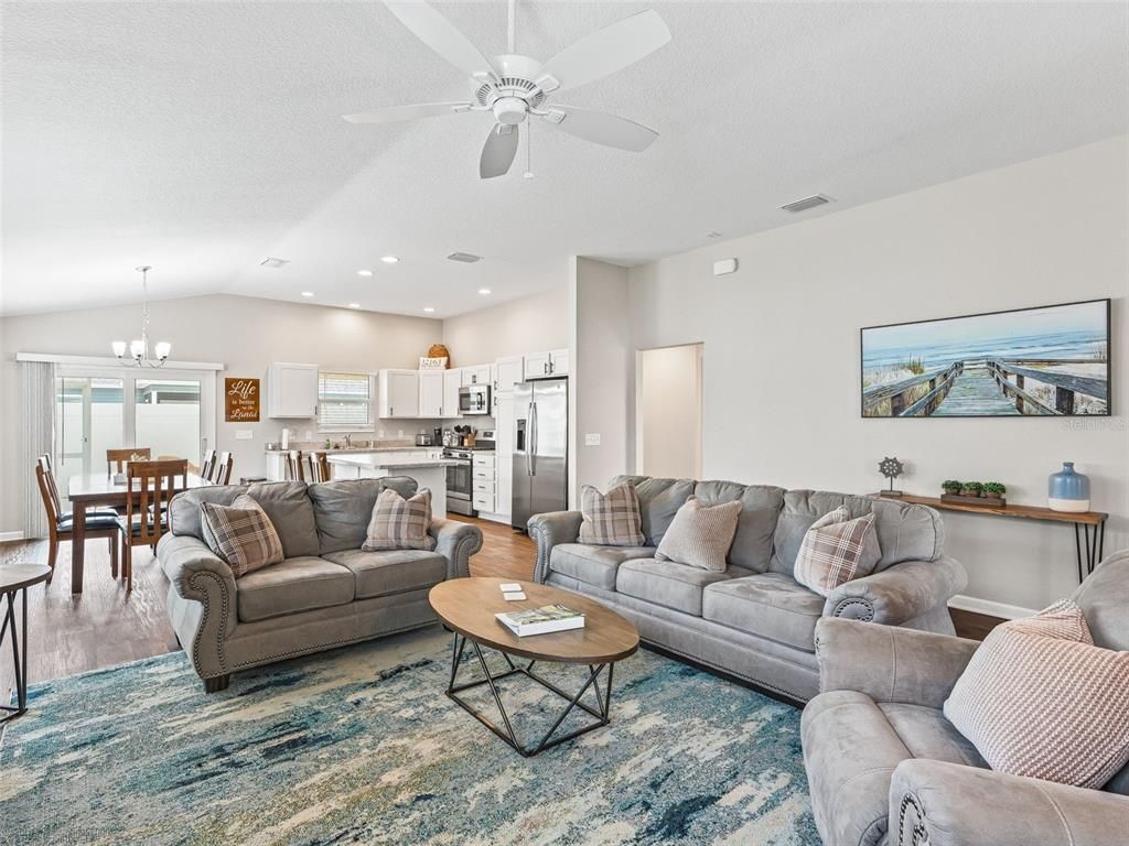 Chandelier, Dining room, Interior, Kitchen, Living room, Recessed Lighting, Stainless Steel Appliances, Wood Texture Flooring