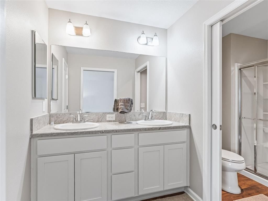 Bathroom, Dual Sink Vanities, Glass Shower, Interior, Wood Texture Flooring