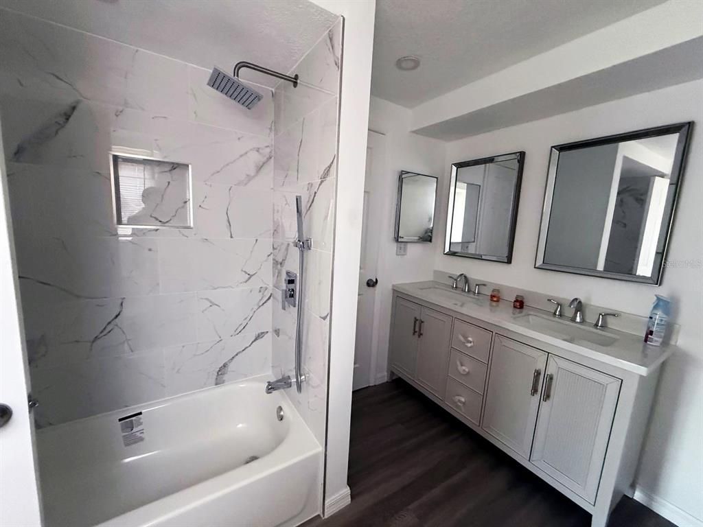Bathroom, Dual Sink Vanities, Interior, Marble Walls, Wood Texture Flooring