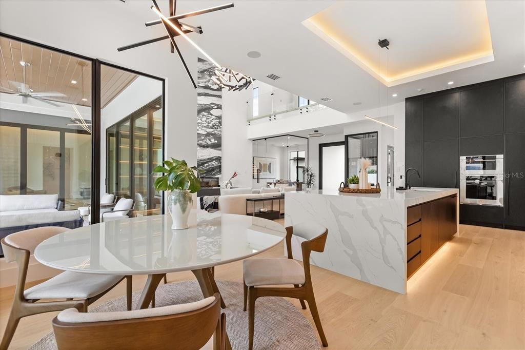 Dining room, Interior, Kitchen, Pendant Lights, Recessed Lighting, Stainless Steel Appliances, Wood Texture Flooring