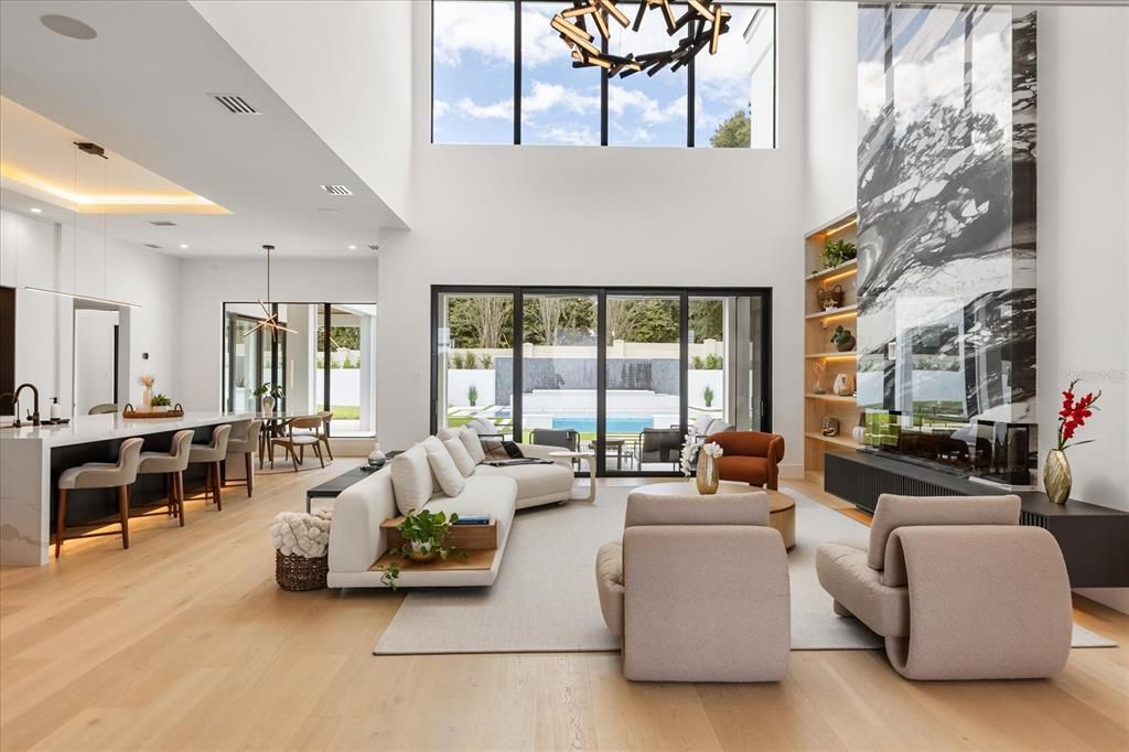 Dining room, Fireplace, Interior, Living room, Pendant Lights, Recessed Lighting, Water, Wood Texture Flooring
