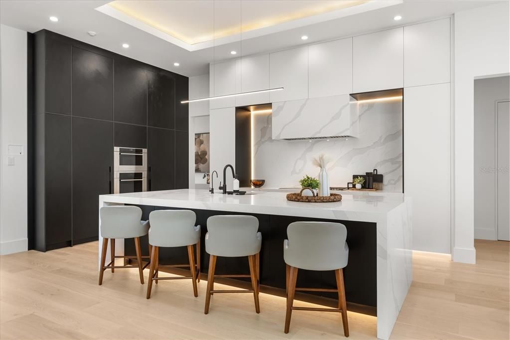 Interior, Kitchen, Marble Walls, Pendant Lights, Recessed Lighting, Stainless Steel Appliances, Wood Texture Flooring