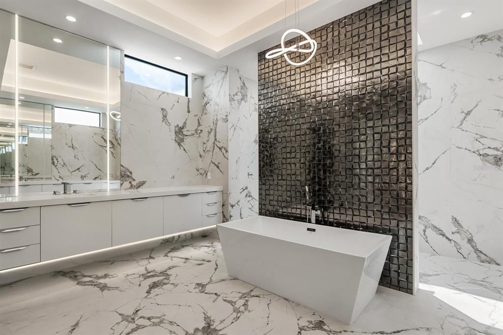 Bathroom, Dual Sink Vanities, Free Standing Baths, Interior, Marble, Marble Walls, Pendant Lights, Recessed Lighting