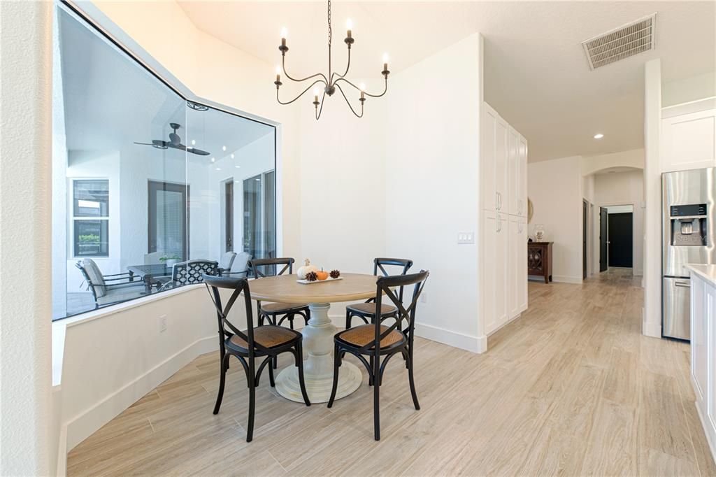 Chandelier, Dining room, Interior, Kitchen, Recessed Lighting, Stainless Steel Appliances, Wood Texture Flooring