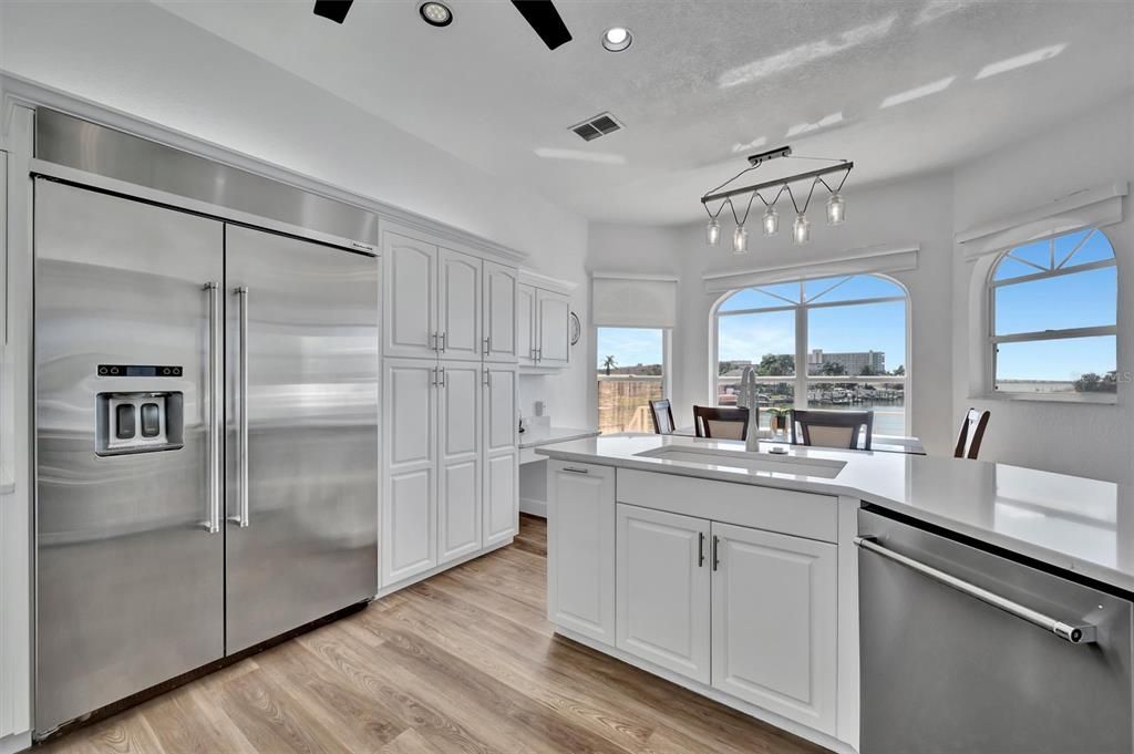 Dining room, Interior, Kitchen, Recessed Lighting, Stainless Steel Appliances, Wood Texture Flooring