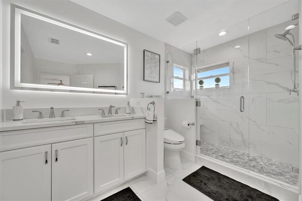 Bathroom, Dual Sink Vanities, Glass Shower, Interior, Marble, Marble Walls, Recessed Lighting
