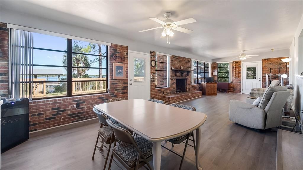 Dining room, Fireplace, Interior, Stone Walls, Water, Wood Texture Flooring