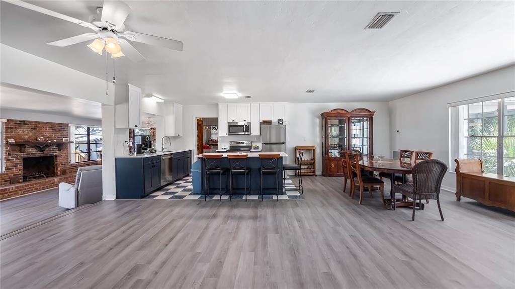 Dining room, Fireplace, Interior, Kitchen, Stainless Steel Appliances, Stone Walls, Wood Texture Flooring