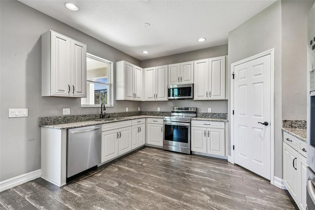 Interior, Kitchen, Recessed Lighting, Stainless Steel Appliances, Wood Texture Flooring