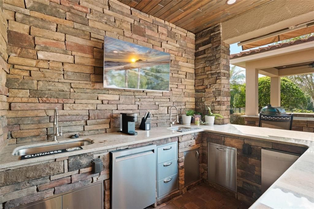 Exterior, Outdoor Kitchen, Stainless Steel Appliances, Stone Walls