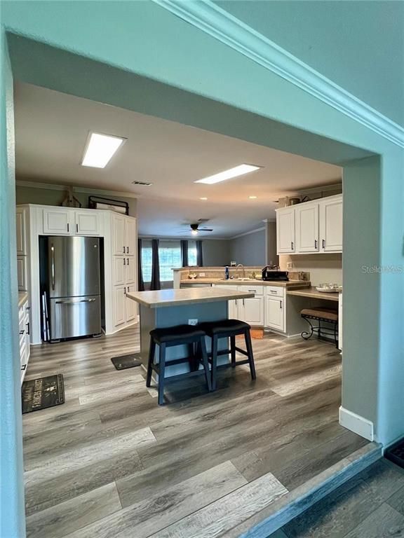 Dining room, Interior, Kitchen, Recessed Lighting, Stainless Steel Appliances, Wood Texture Flooring