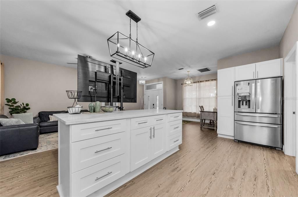 Chandelier, Interior, Kitchen, Living room, Pendant Lights, Recessed Lighting, Stainless Steel Appliances, Wood Texture Flooring