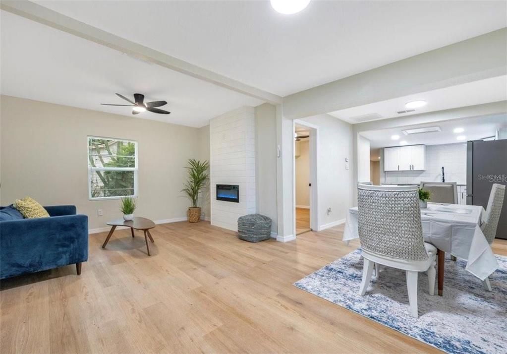 Dining room, Fireplace, Interior, Kitchen, Recessed Lighting, Stone Walls, Wood Texture Flooring