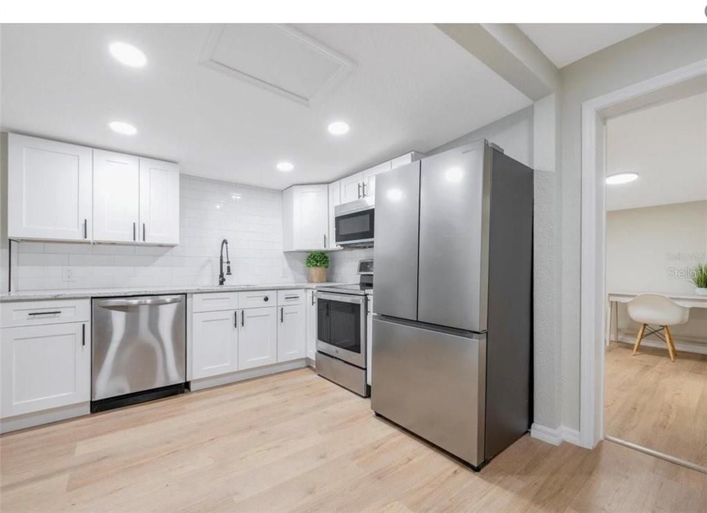 Dining room, Interior, Kitchen, Recessed Lighting, Stainless Steel Appliances, Wood Texture Flooring