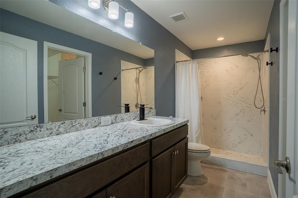 Bathroom, Dual Sink Vanities, Interior, Marble Walls, Recessed Lighting