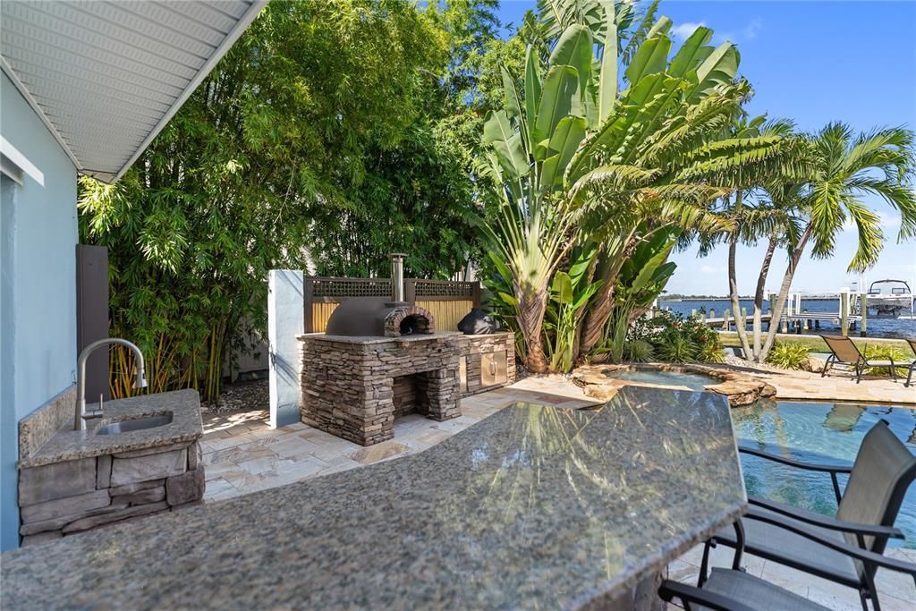 Exterior, Fireplace, Outdoor Kitchen, Pool, Water