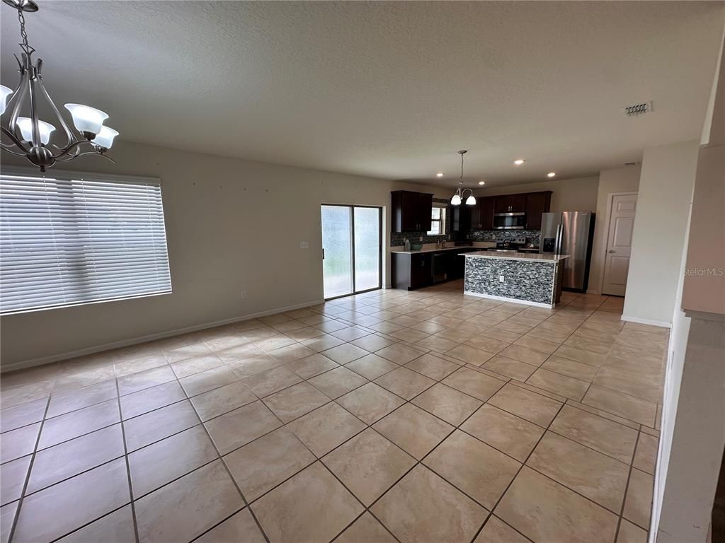 Chandelier, Empty room, Interior, Kitchen, Pendant Lights, Recessed Lighting, Stainless Steel Appliances