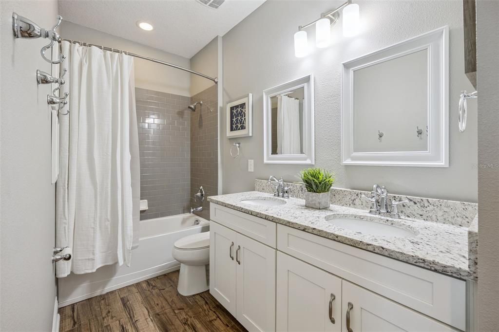 Bathroom, Dual Sink Vanities, Interior, Recessed Lighting, Wood Texture Flooring