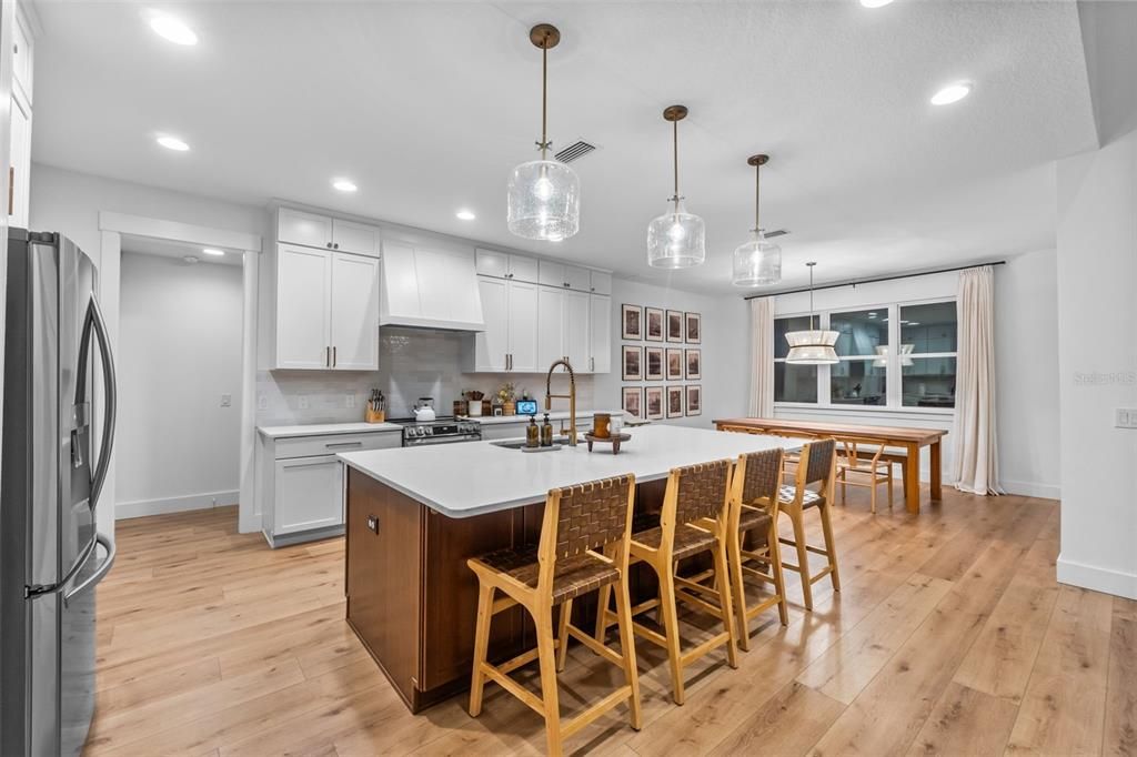 Dining room, Interior, Kitchen, Pendant Lights, Recessed Lighting, Stainless Steel Appliances, Wood Texture Flooring