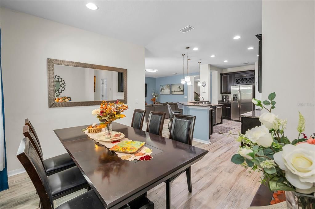 Dining room, Interior, Kitchen, Pendant Lights, Recessed Lighting, Stainless Steel Appliances, Wood Texture Flooring