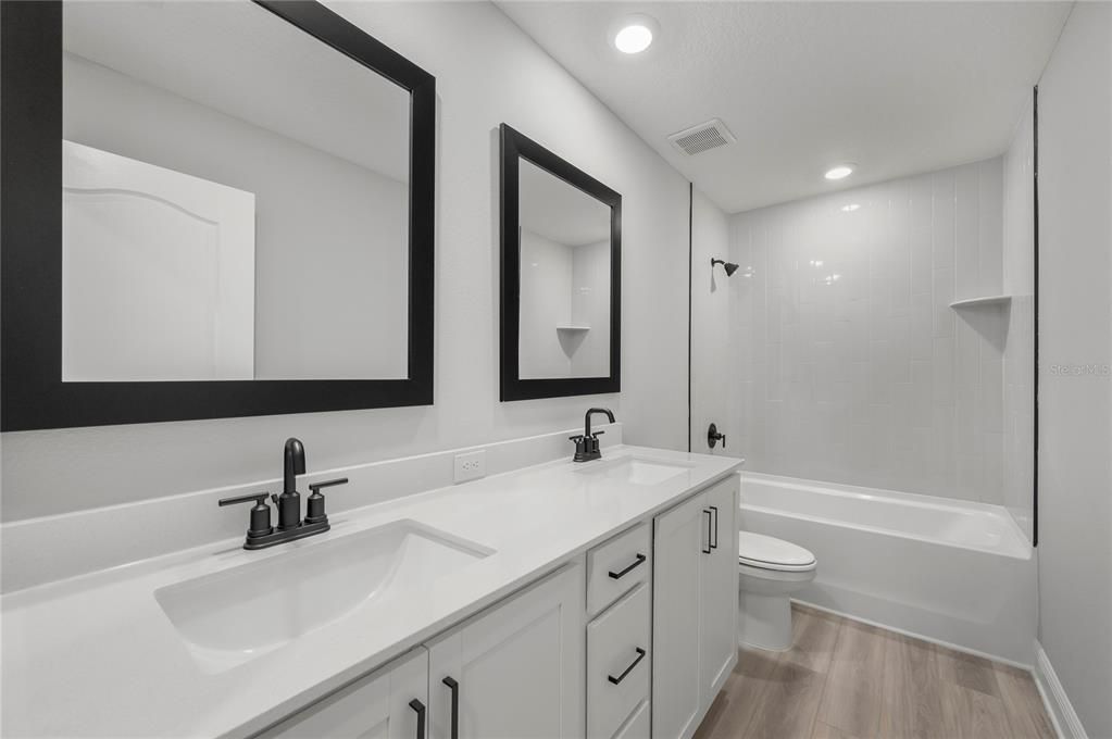 Bathroom, Dual Sink Vanities, Interior, Recessed Lighting, Wood Texture Flooring