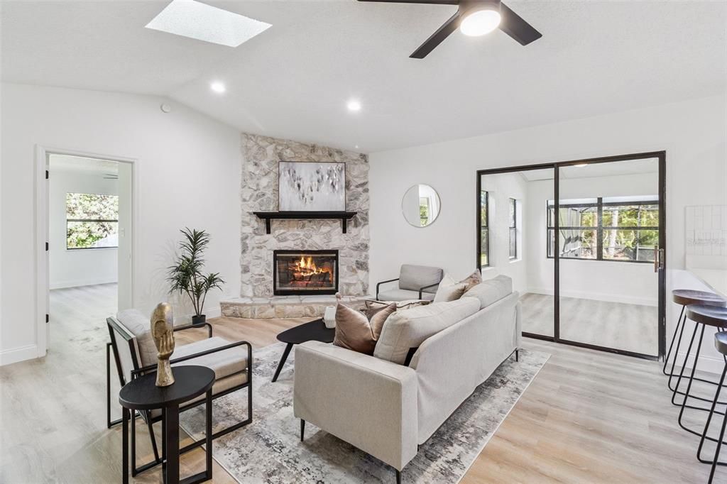 Fireplace, Interior, Living room, Recessed Lighting, Stone Walls, Wood Texture Flooring