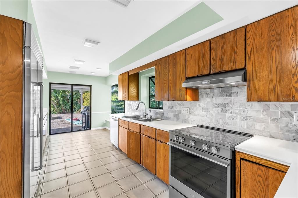 Interior, Kitchen, Marble Walls, Recessed Lighting, Stainless Steel Appliances