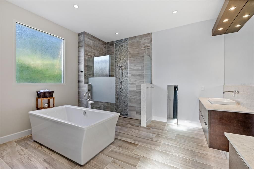 Bathroom, Free Standing Baths, Glass Shower, Interior, Recessed Lighting, Wood Texture Flooring