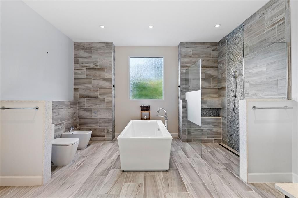 Bathroom, Free Standing Baths, Glass Shower, Interior, Recessed Lighting, Wood Texture Flooring, Wooden Walls