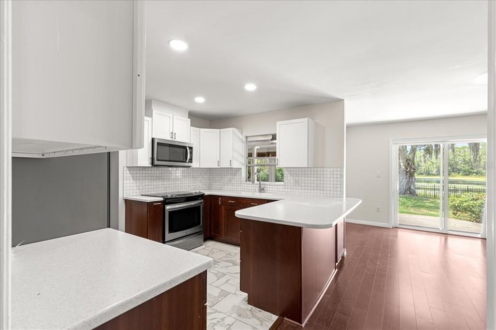 Interior, Kitchen, Marble, Recessed Lighting, Stainless Steel Appliances, Wood Texture Flooring